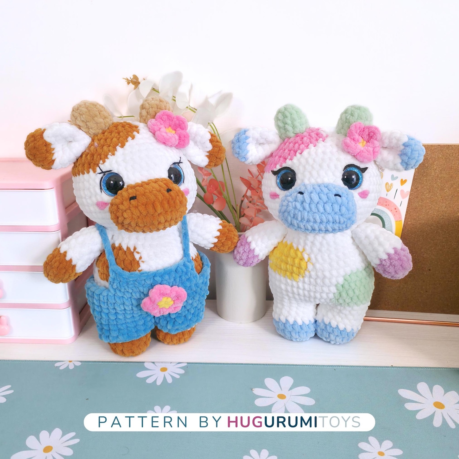 Amigurumi crochet cow wearing blue overalls sitting on a white background – view 5
